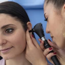 Woman getting an ear exam from her ENT